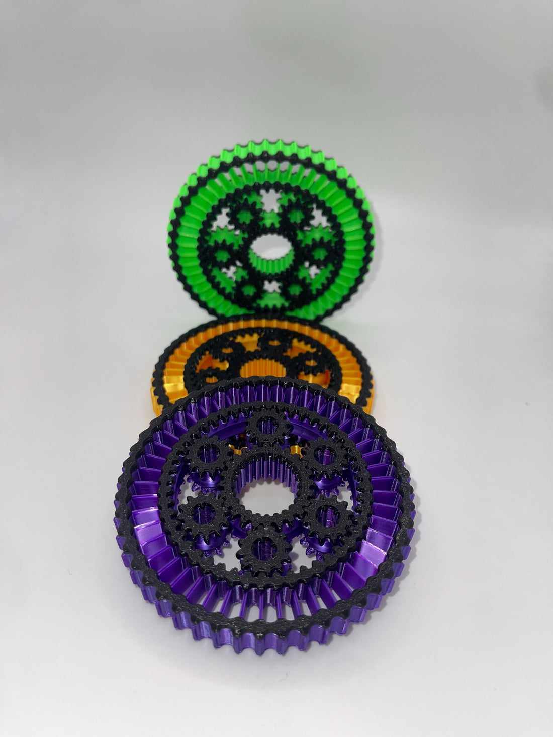 Planetary Gear Fidget Spinner | Mechanical Desk Toy | Stress Relief Fidget for Focus & Relaxation displayed in vibrant colors.
